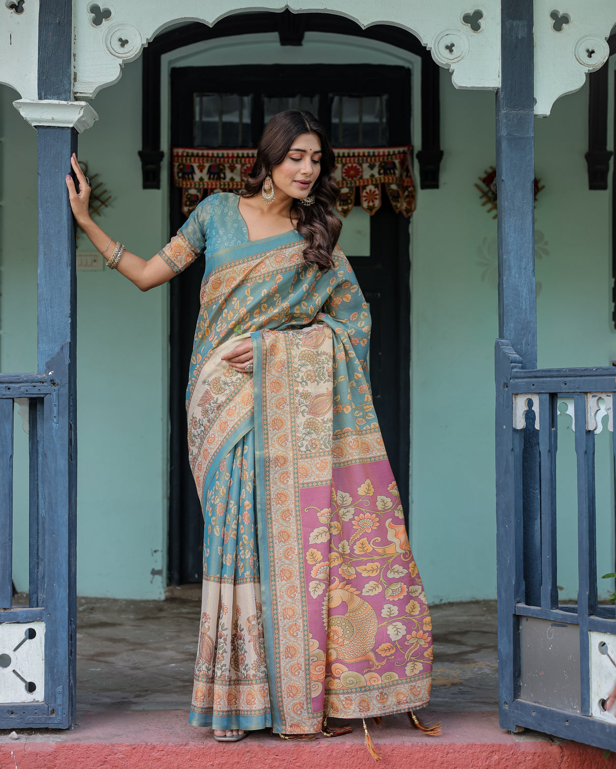 Turquoise blue handloom cotton saree with multicolor floral pallu peach border