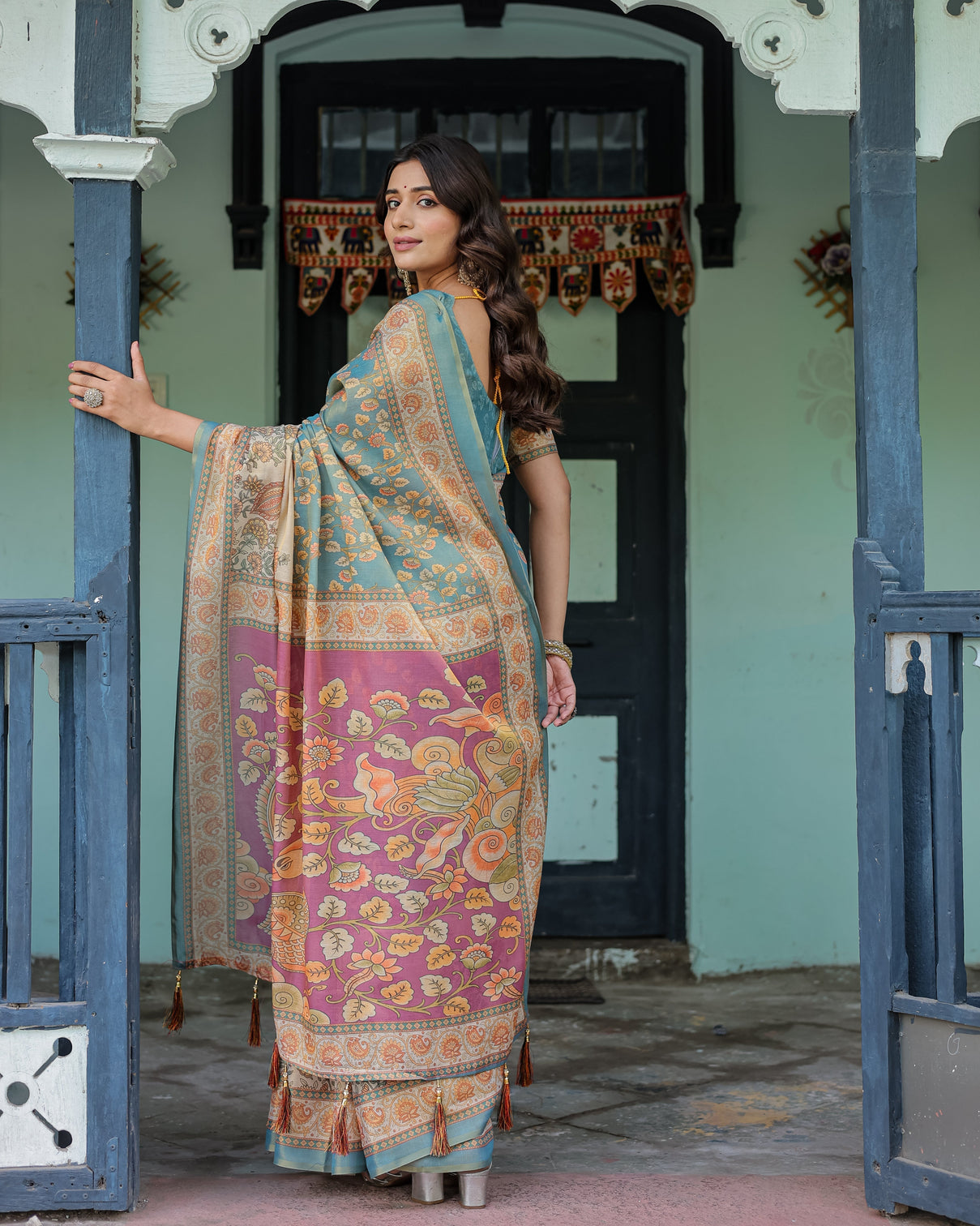 Turquoise blue handloom cotton saree with multicolor floral pallu peach border