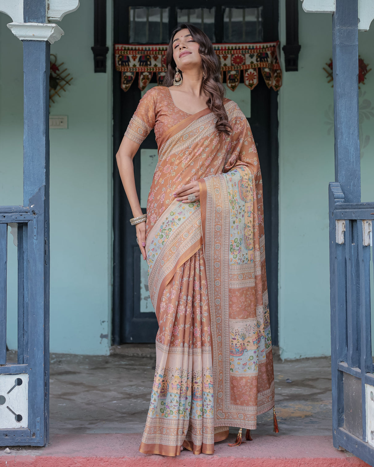 Burnt peach handloom cotton saree with floral buta design village scene pallu