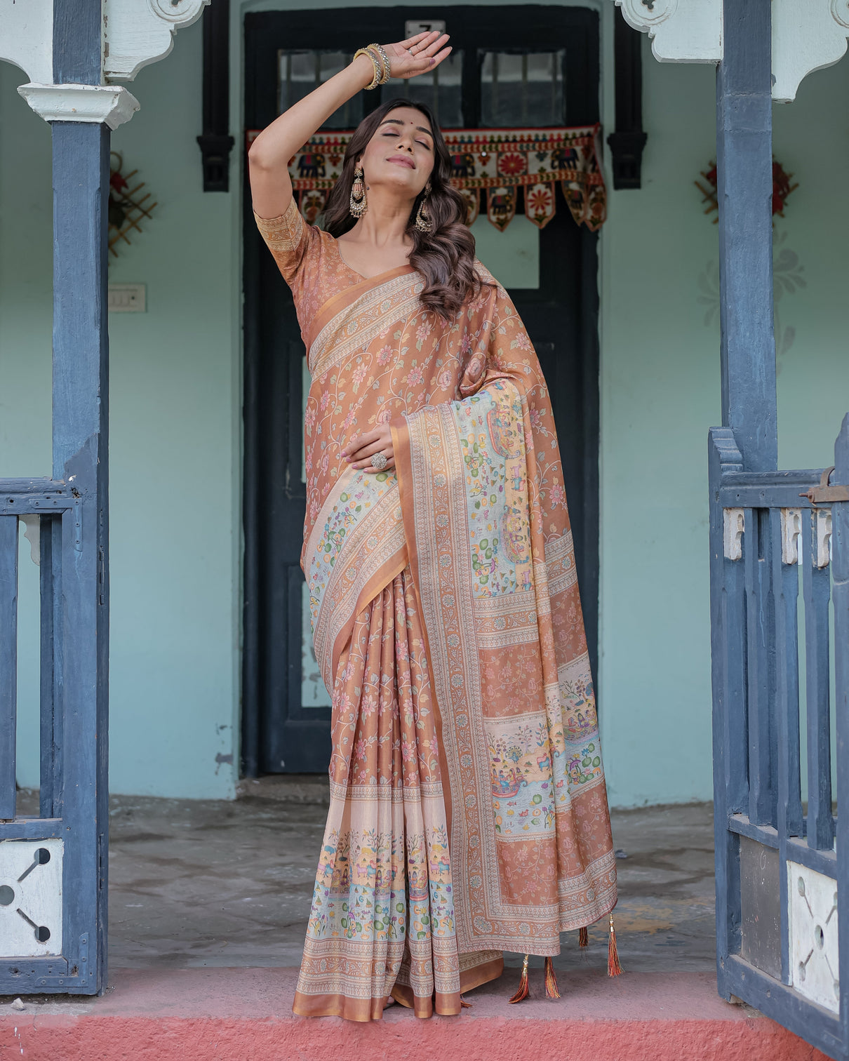 Burnt peach handloom cotton saree with floral buta design village scene pallu