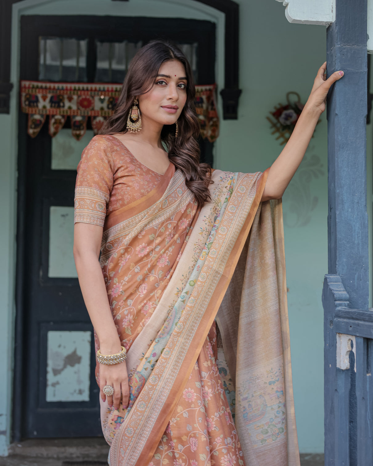 Burnt peach handloom cotton saree with floral buta design village scene pallu