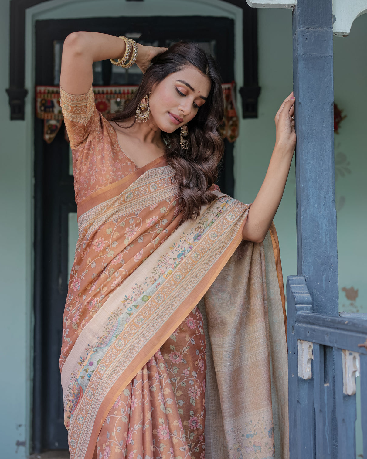 Burnt peach handloom cotton saree with floral buta design village scene pallu