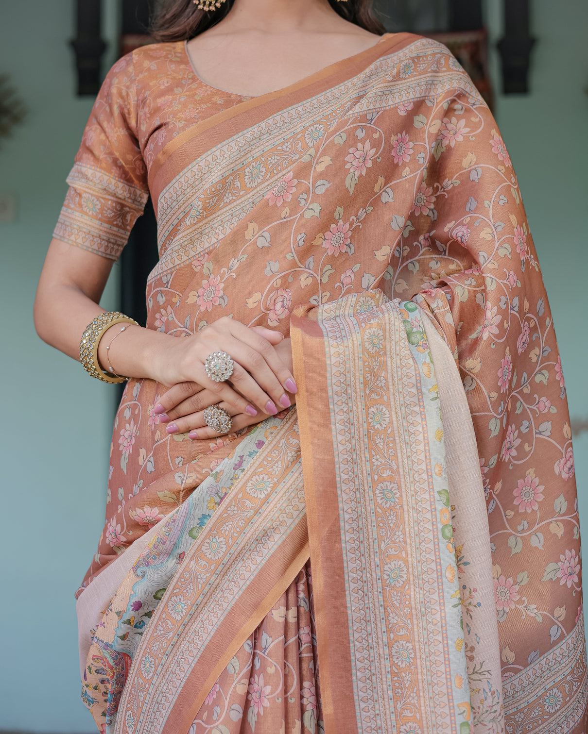 Burnt peach handloom cotton saree with floral buta design village scene pallu