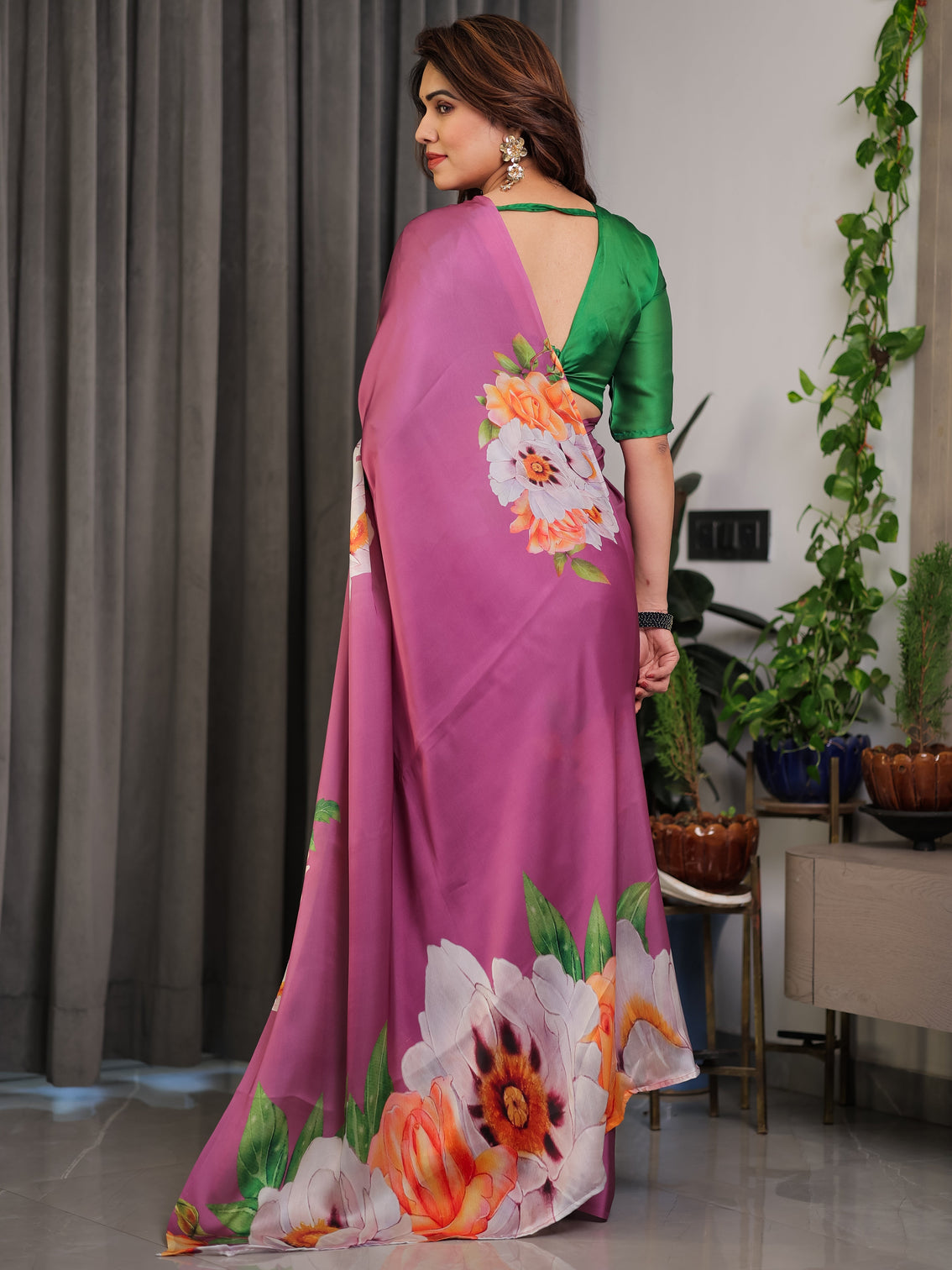 Pink satin georgette saree with bold floral prints matching attached blouse festive partywear elegance