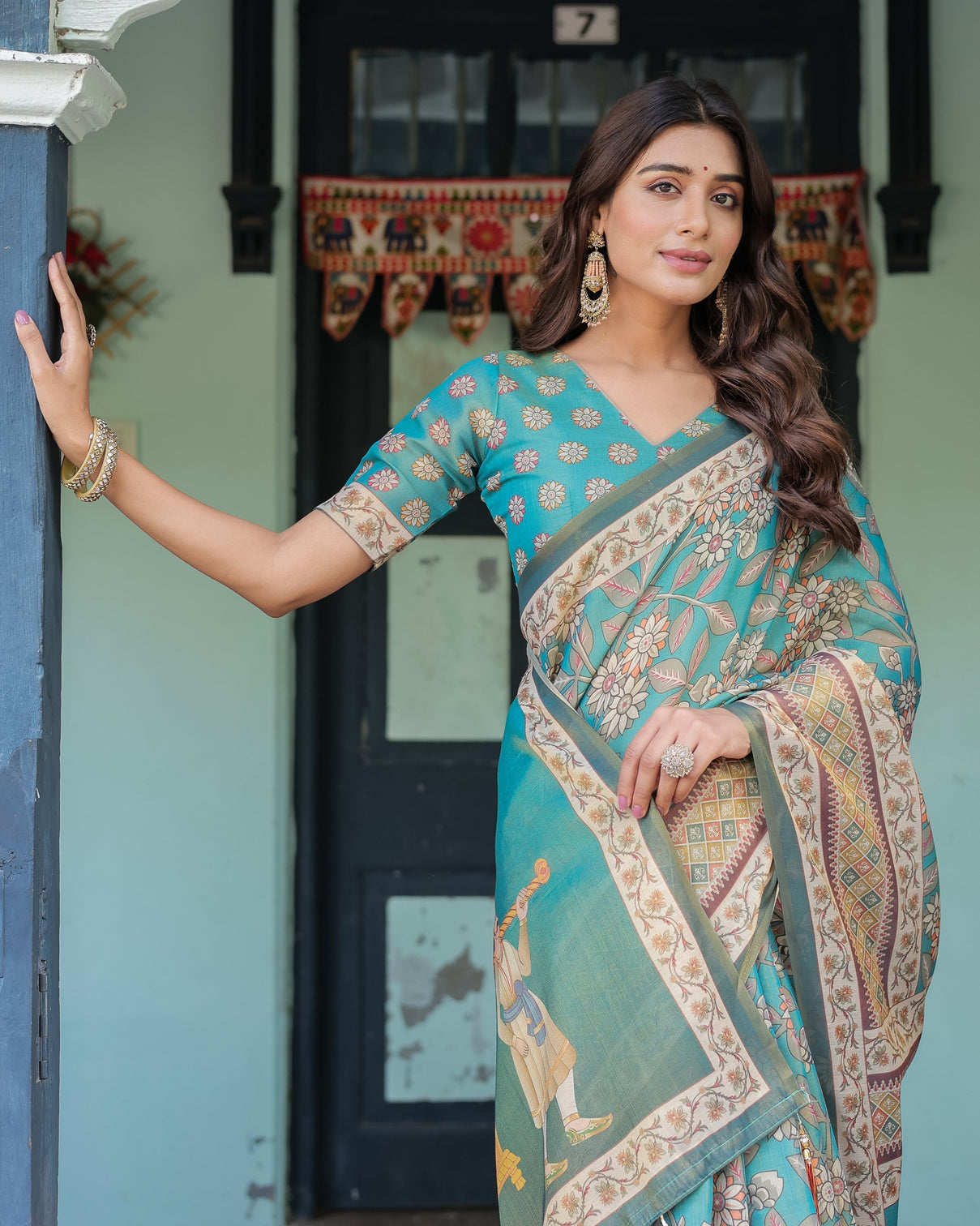 Teal green handloom cotton saree with floral print royal bridal procession pallu