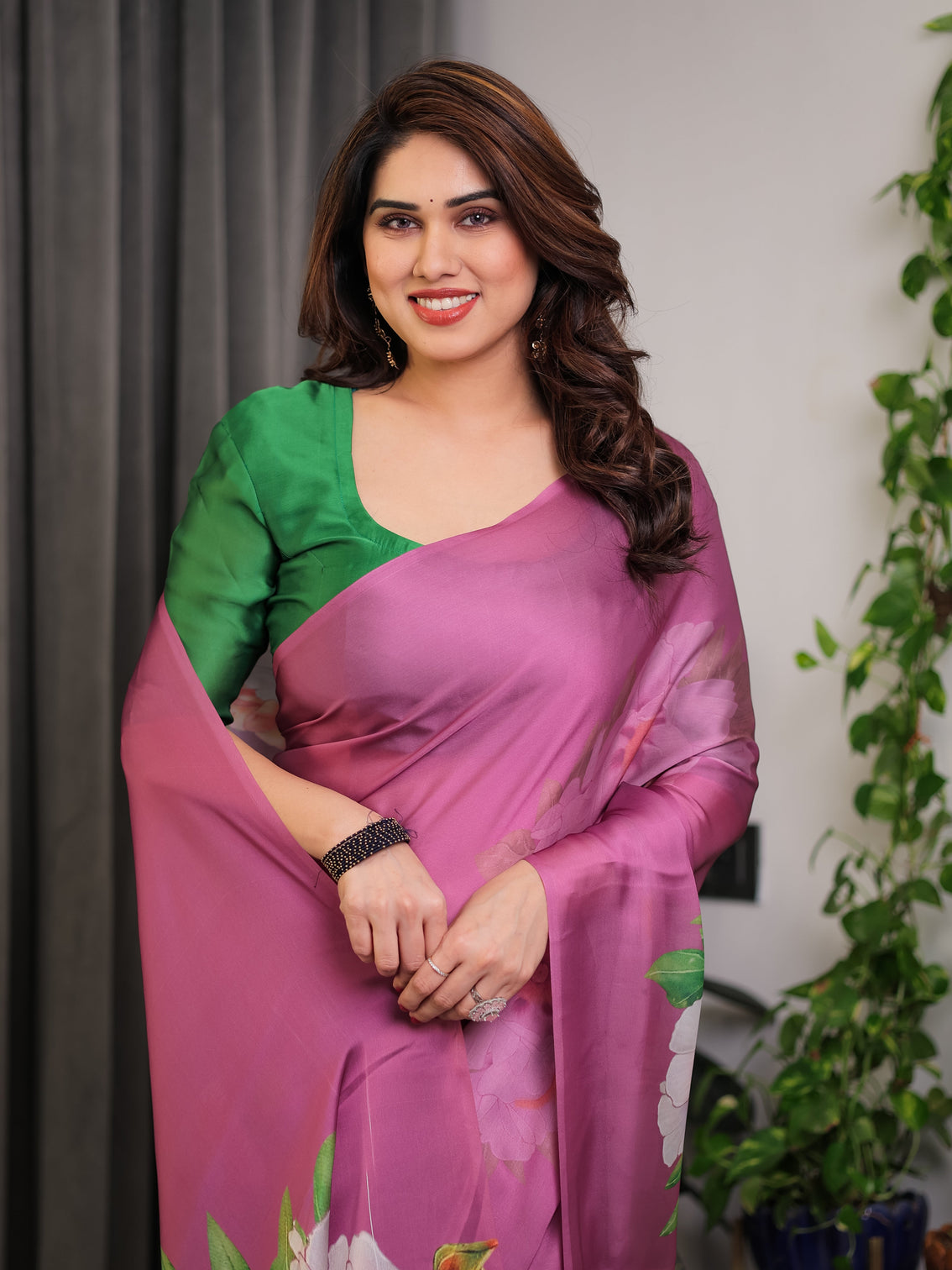 Pink satin georgette saree with bold floral prints matching attached blouse festive partywear elegance