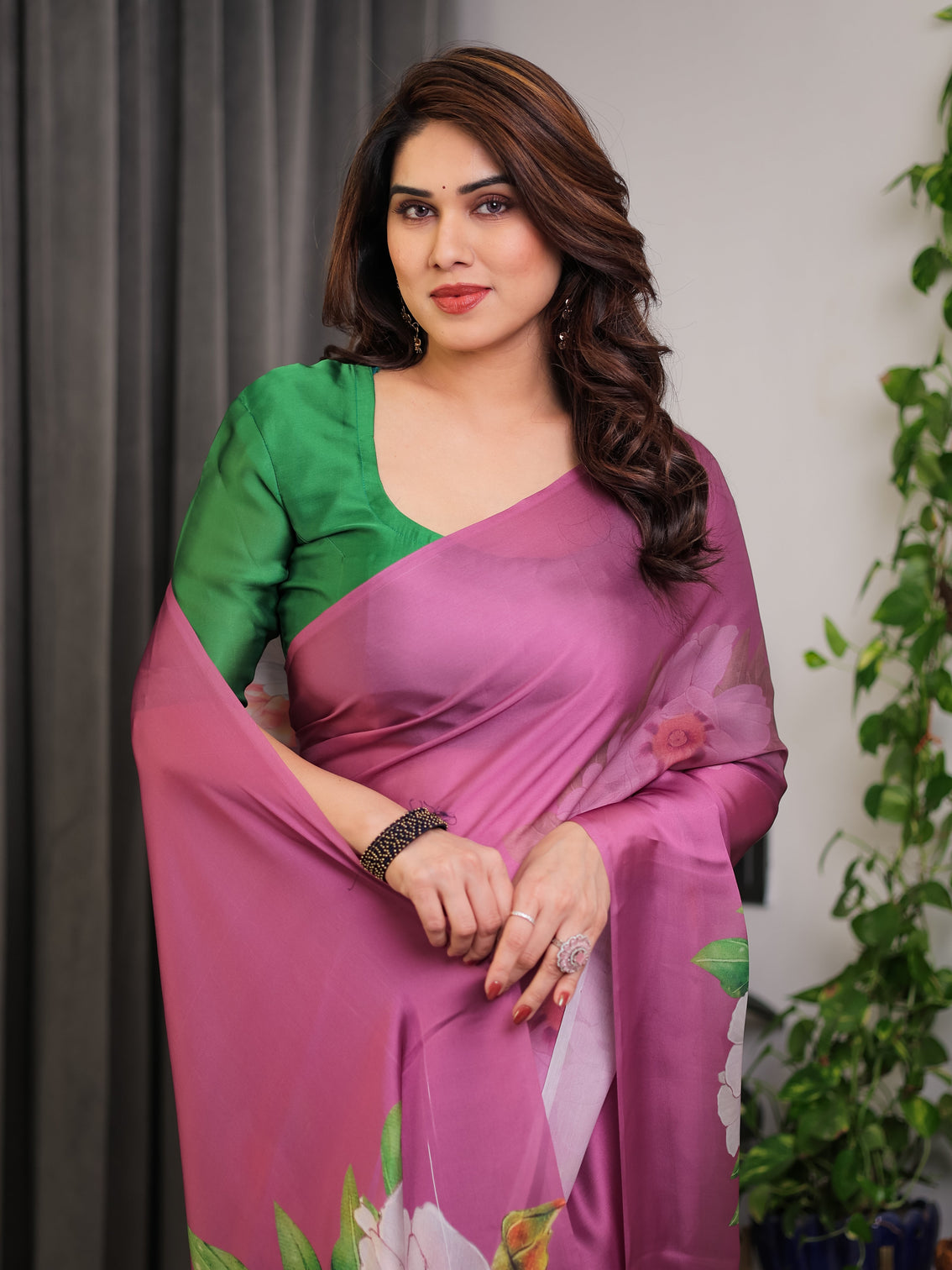 Pink satin georgette saree with bold floral prints matching attached blouse festive partywear elegance