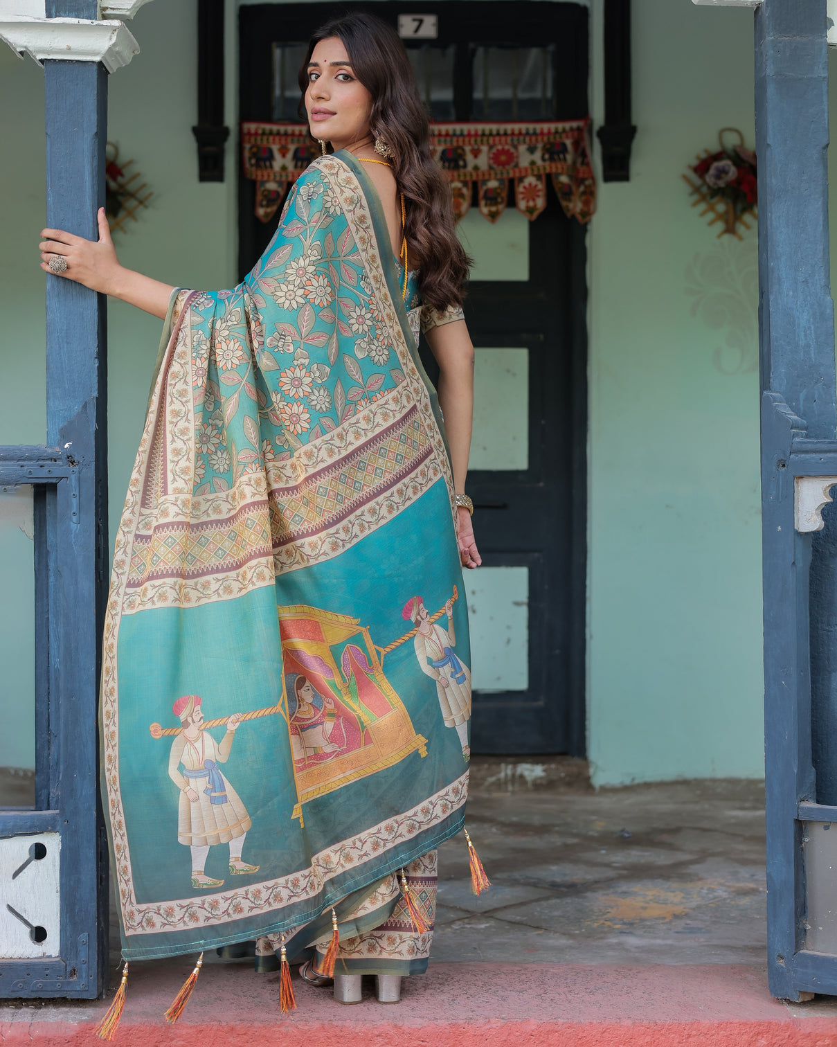 Teal green handloom cotton saree with floral print royal bridal procession pallu