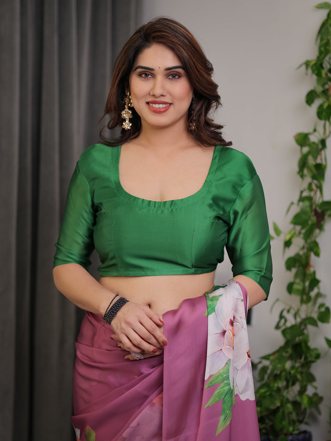 Pink satin georgette saree with bold floral prints matching attached blouse festive partywear elegance