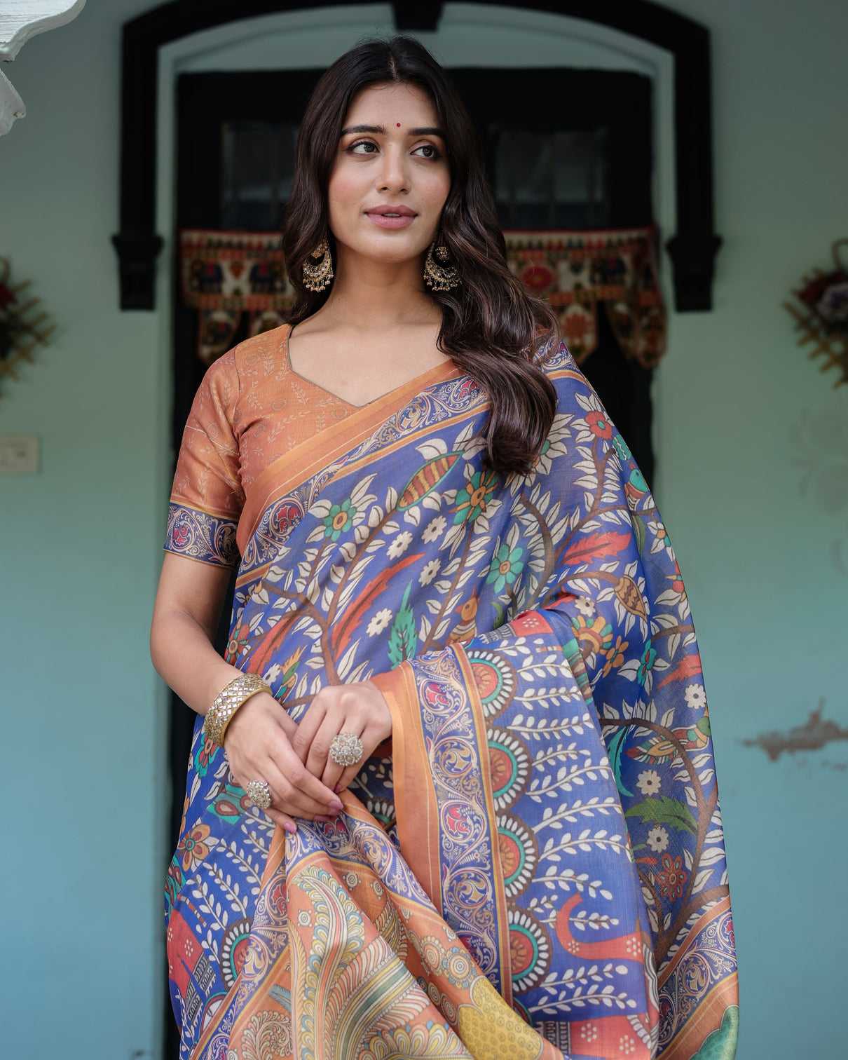 Royal blue rust handloom cotton saree with bold floral print grand peacock pallu