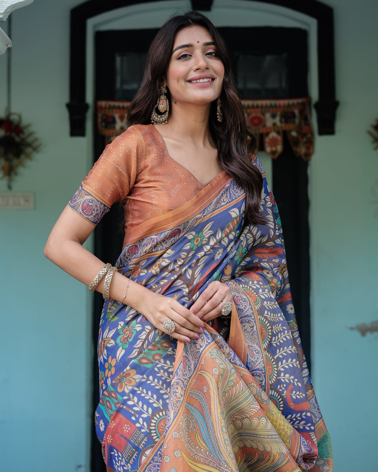 Royal blue rust handloom cotton saree with bold floral print grand peacock pallu