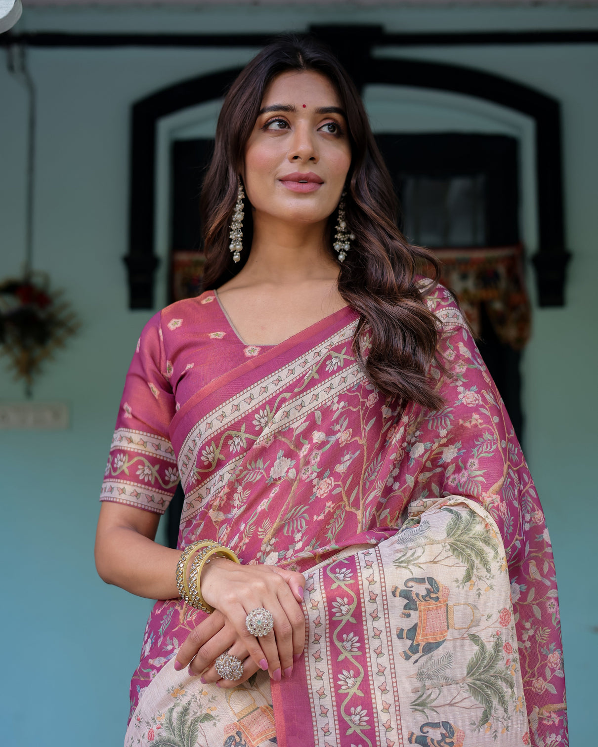 Rose pink handloom cotton saree with ivory elephant procession pallu floral print