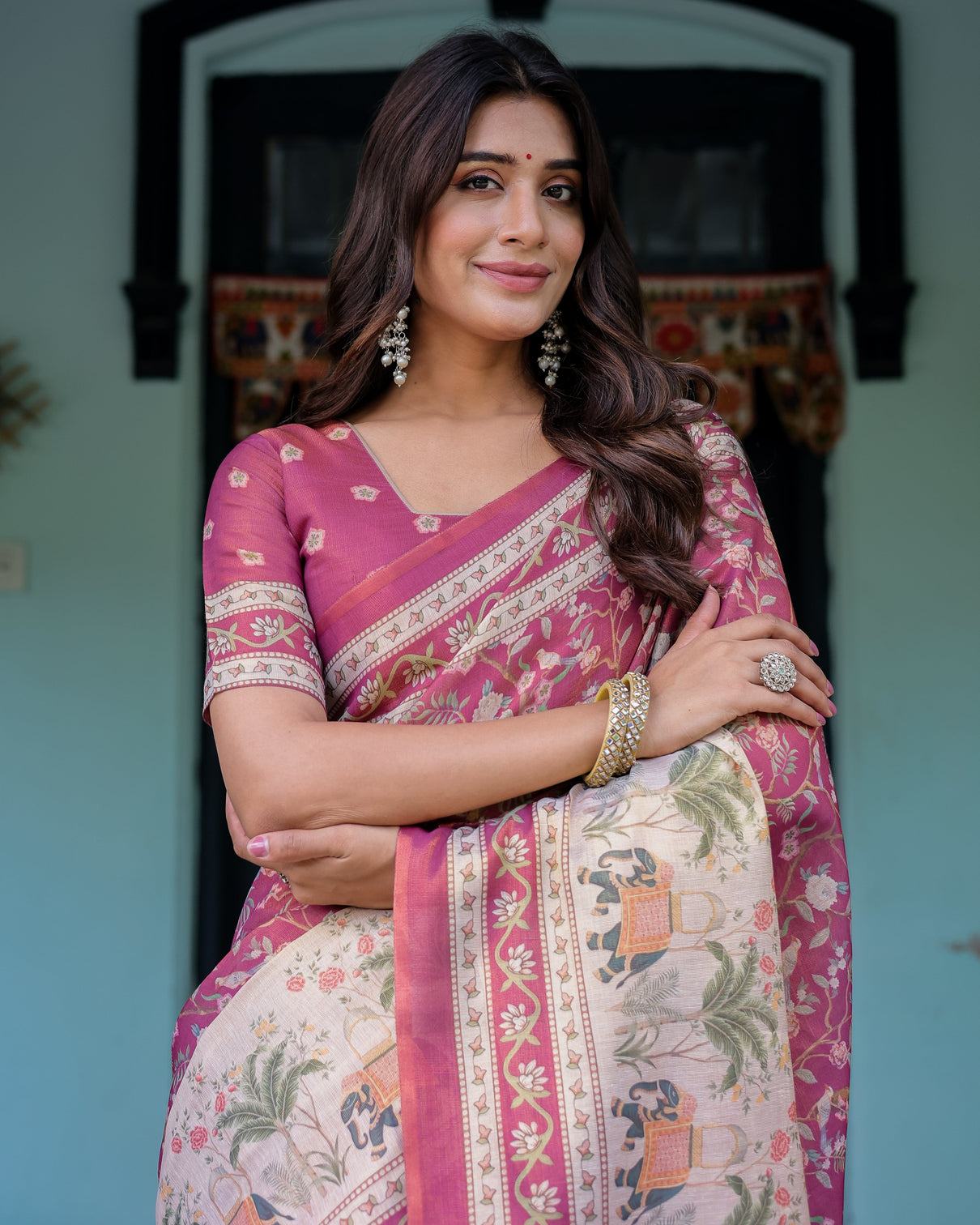 Rose pink handloom cotton saree with ivory elephant procession pallu floral print
