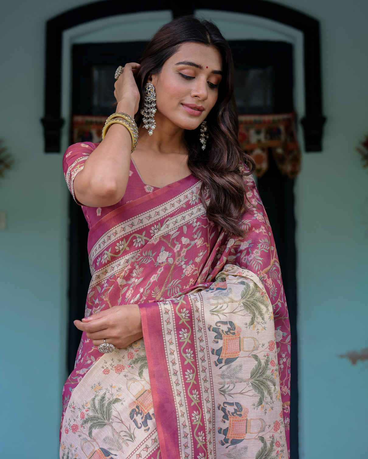 Rose pink handloom cotton saree with ivory elephant procession pallu floral print