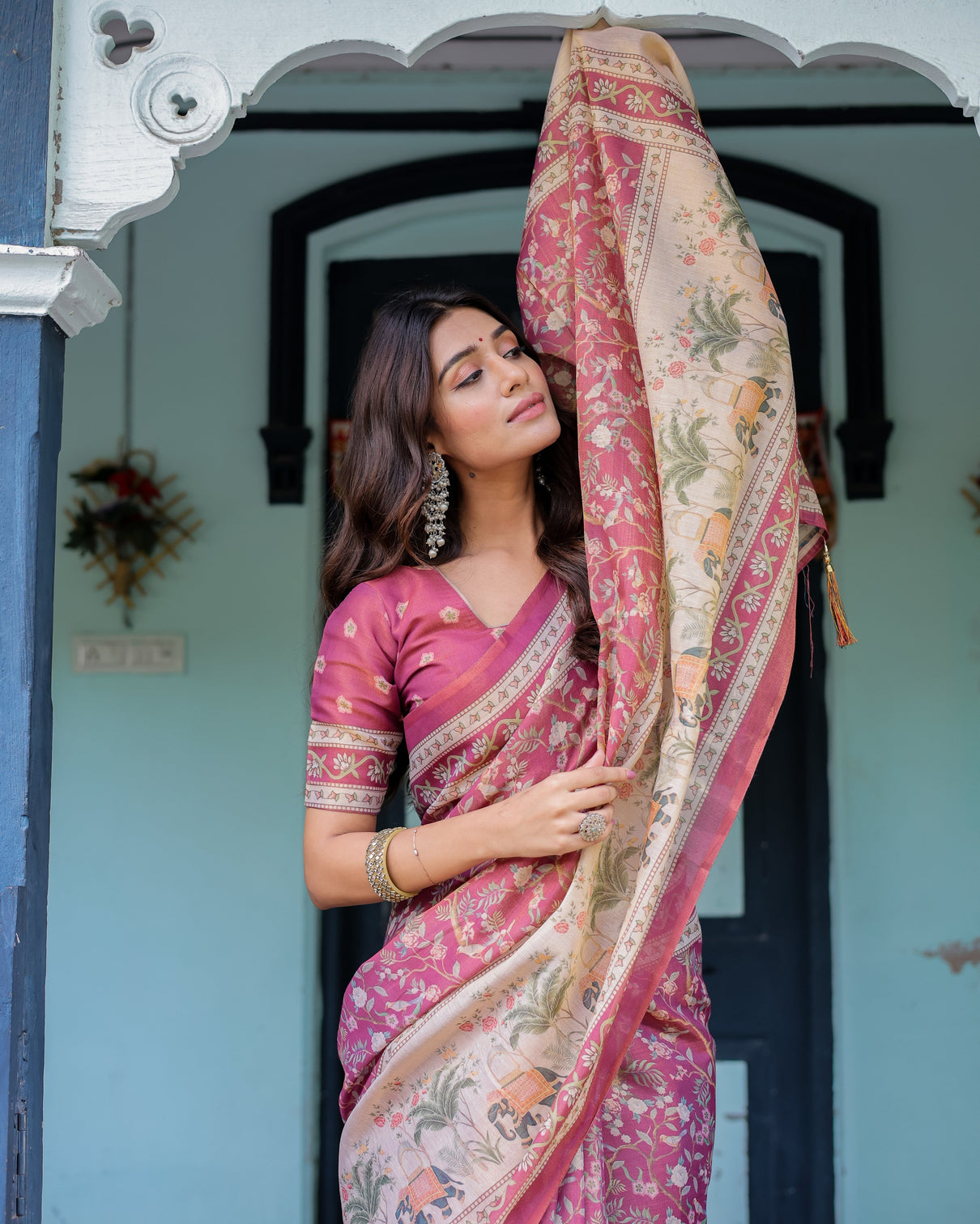 Rose pink handloom cotton saree with ivory elephant procession pallu floral print