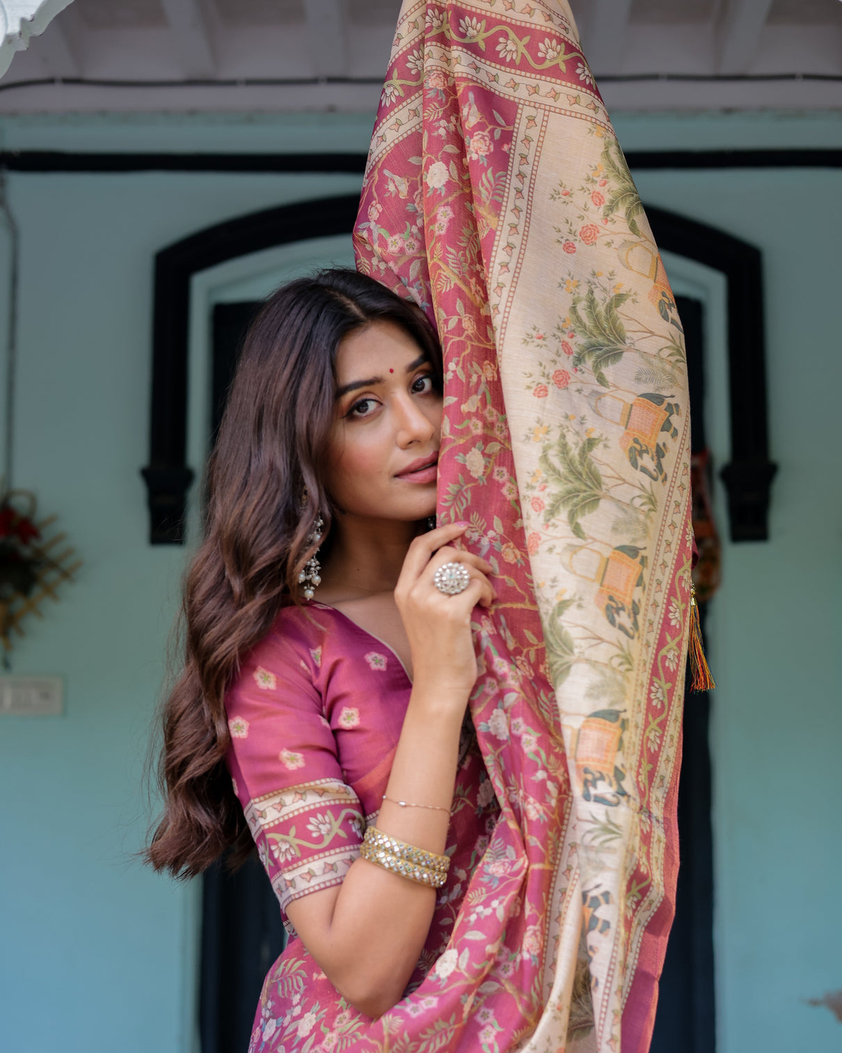 Rose pink handloom cotton saree with ivory elephant procession pallu floral print