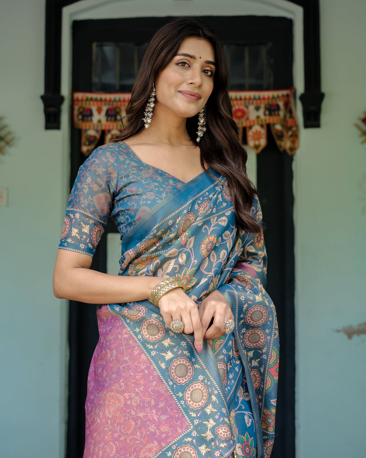 Dusty blue handloom cotton saree with floral print pink cow lotus motif pallu