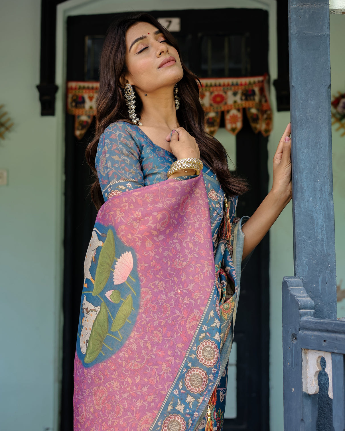 Dusty blue handloom cotton saree with floral print pink cow lotus motif pallu