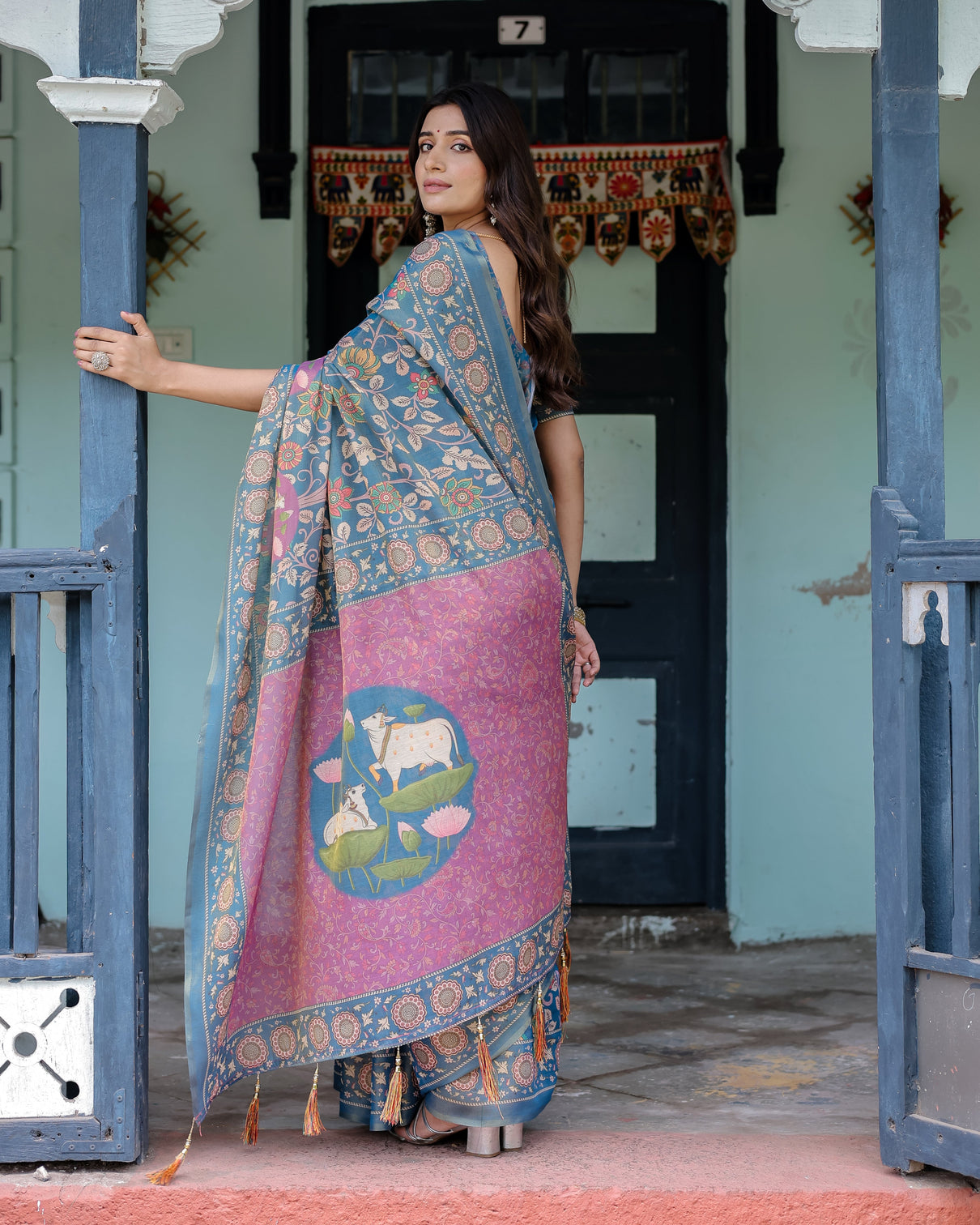 Dusty blue handloom cotton saree with floral print pink cow lotus motif pallu