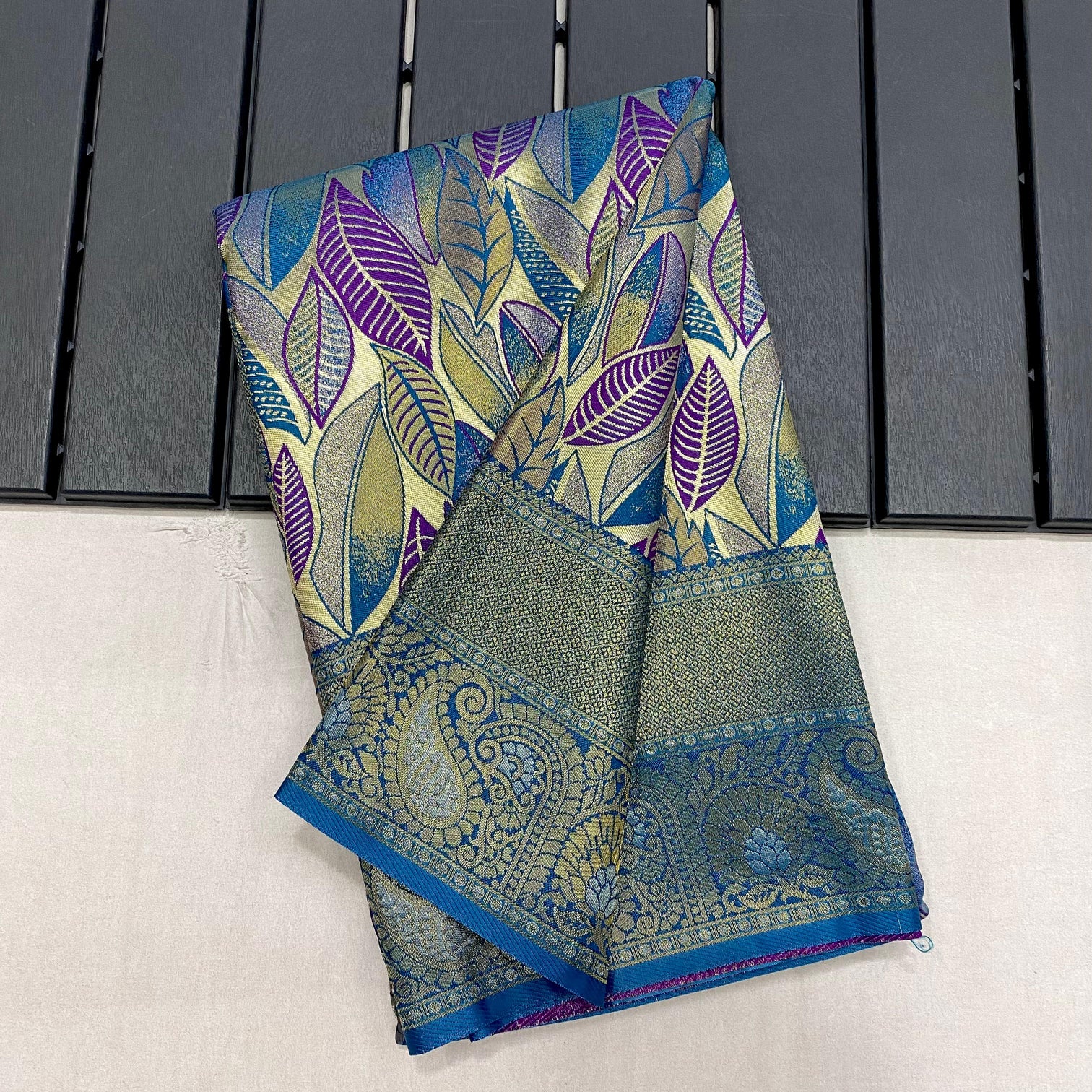 Turquoise kanchipattu silk party wear saree with all over weaves contrast border