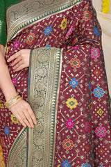 Adorable Wine Soft Patola Silk Saree with Demanding Blouse Piece