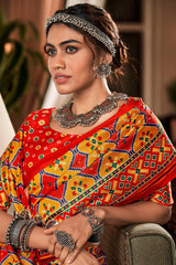 Evanescent Yellow and Red Patola Silk Saree with Imbrication Blouse Piece