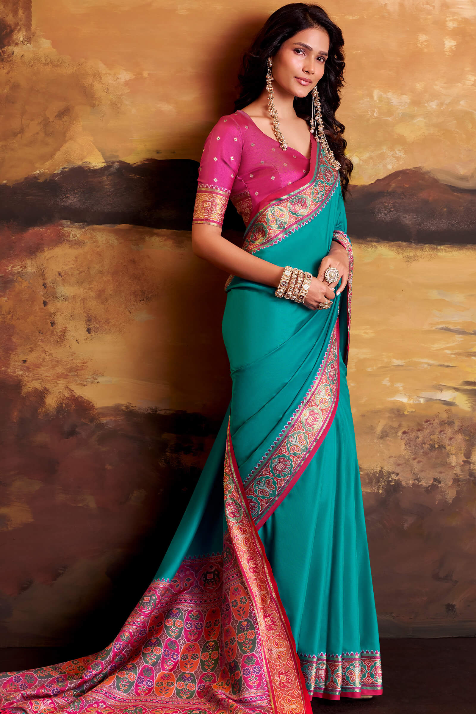 Radiant Firozi Patola Silk Saree with Ineffable Blouse Piece