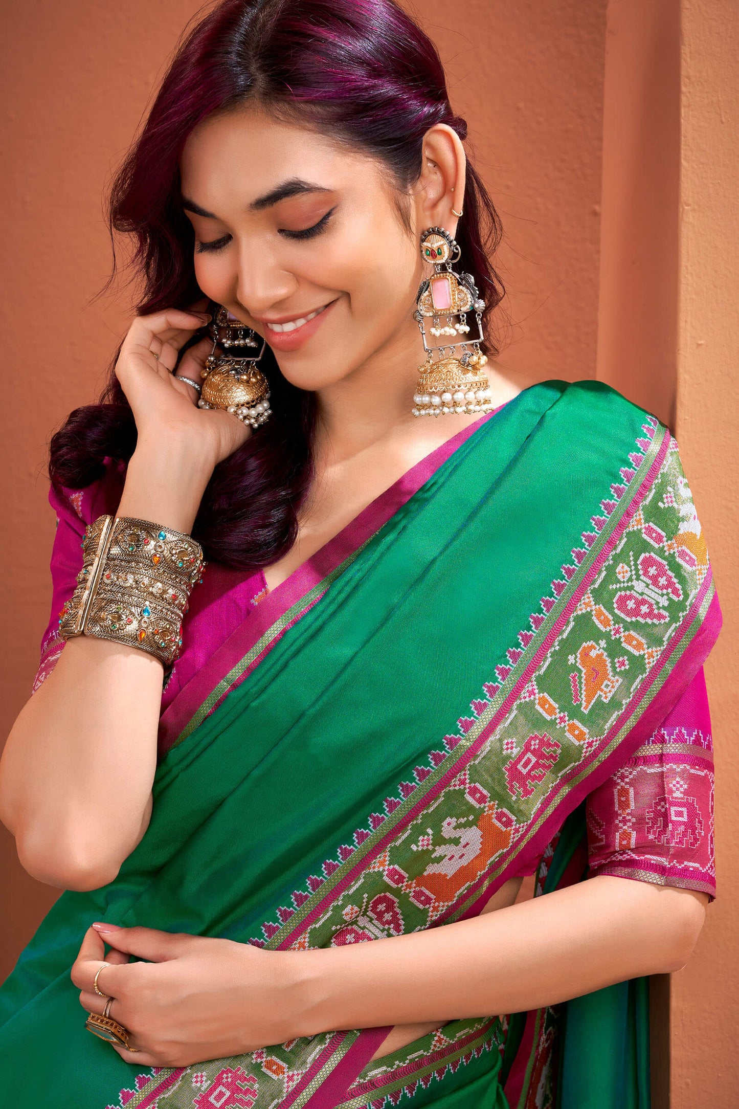 Flamboyant Green Patola Silk Saree with Resplendent Blouse Piece