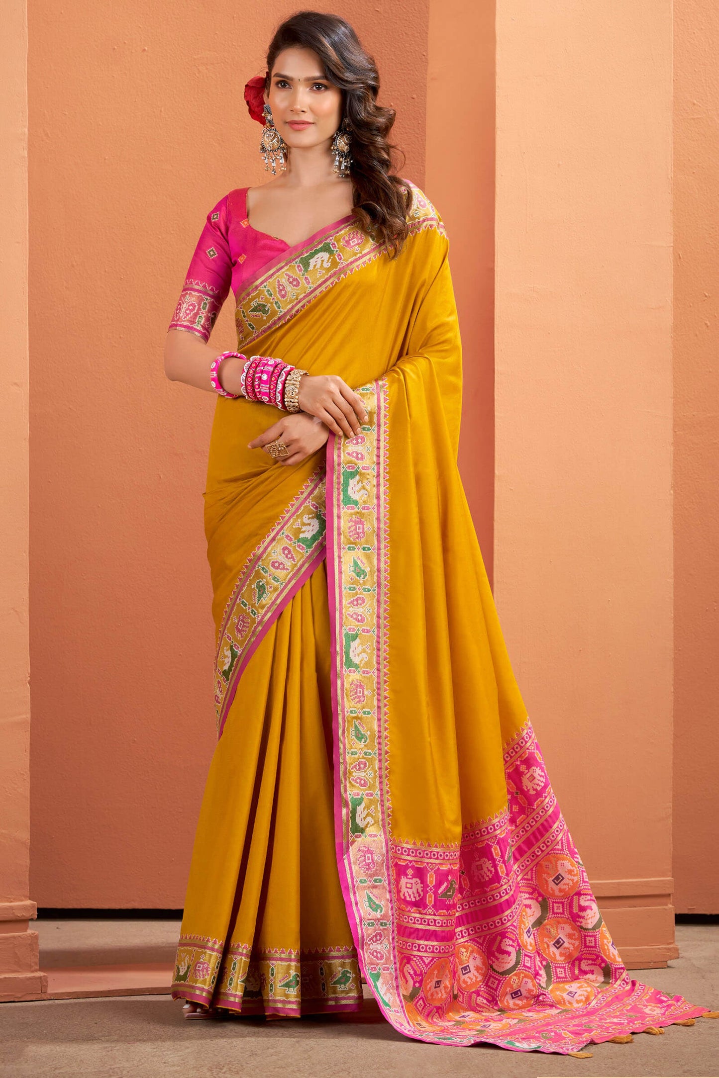 Splendiferous Yellow Patola Silk Saree with Precious Blouse Piece