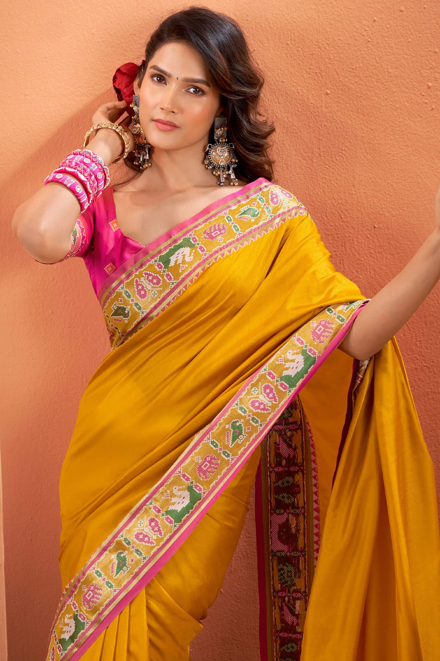 Splendiferous Yellow Patola Silk Saree with Precious Blouse Piece