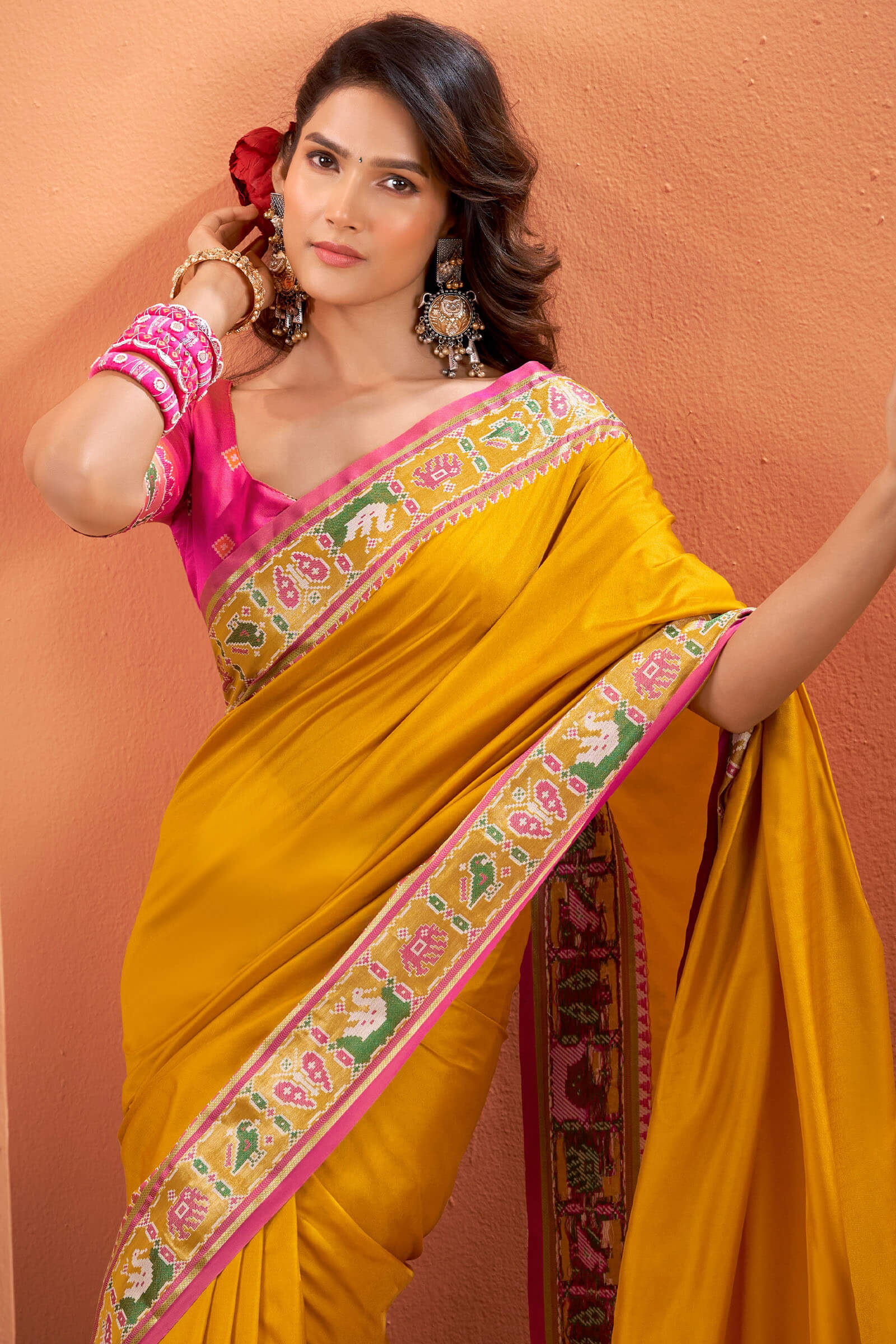 Splendiferous Yellow Patola Silk Saree with Precious Blouse Piece