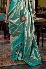 Stunner Turquoise Kanjivaram Silk Saree With Luminous Blouse Piece