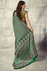 Prominent Green Ajrakh Printed Satin Silk Saree With Prettiest Blouse Piece