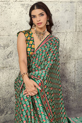 Prominent Green Ajrakh Printed Satin Silk Saree With Prettiest Blouse Piece