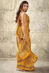 Gratifying Mustard Ajrakh Printed Satin Silk Saree With Enthralling Blouse Piece
