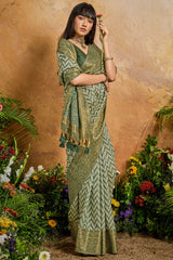 Invaluable Green Viscose Cotton Patola Silk Saree With Petrichor Blouse Piece