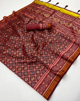 Jazzy Wine Printed Patola Handloom Silk Saree With Pulsating Blouse Piece