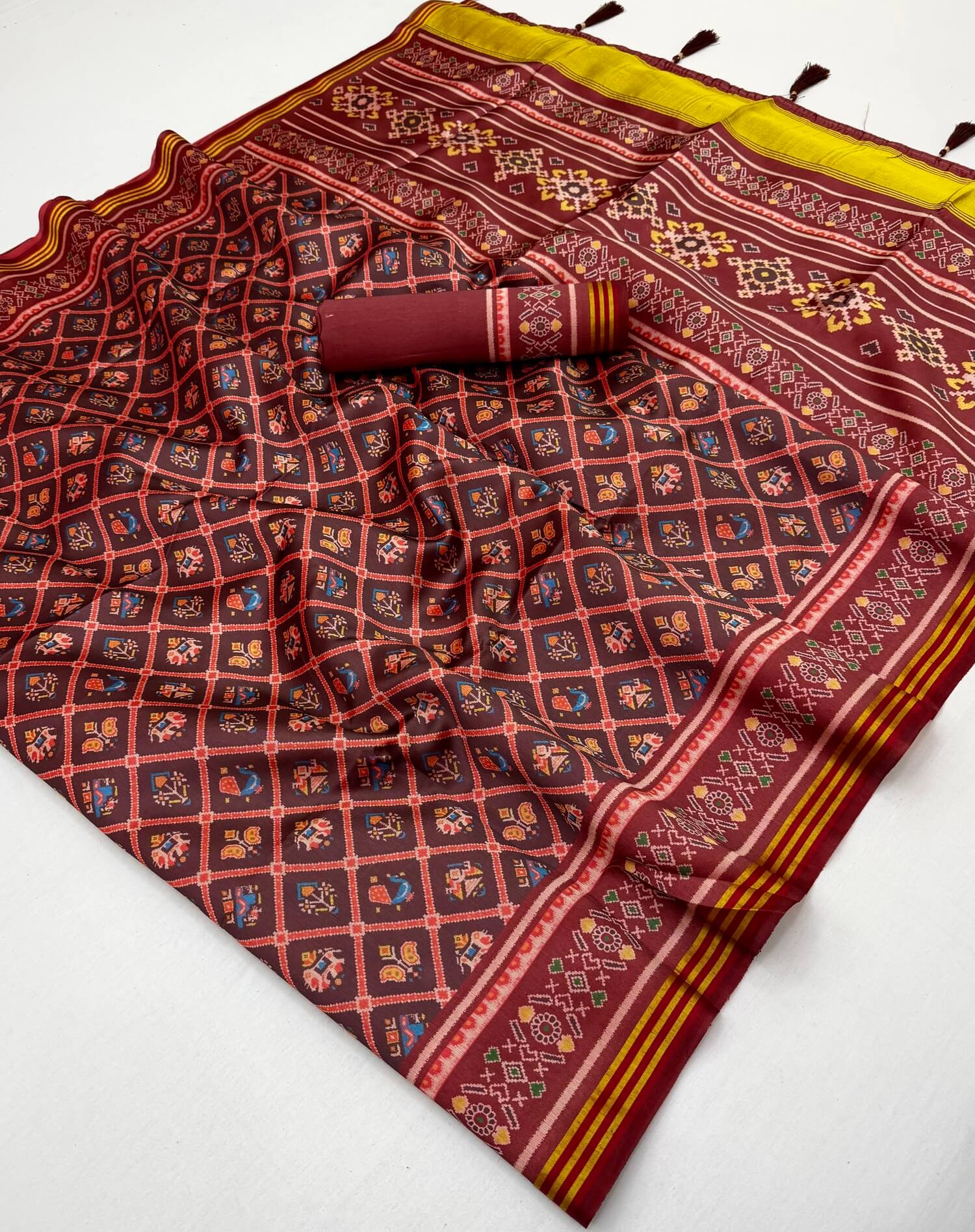 Jazzy Wine Printed Patola Handloom Silk Saree With Pulsating Blouse Piece