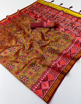 Imbrication Mustard Printed Patola Handloom Silk Saree With Glorious Blouse Piece