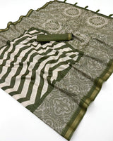 Breathtaking Green Printed Cotton Silk Saree With Adorning Blouse Piece