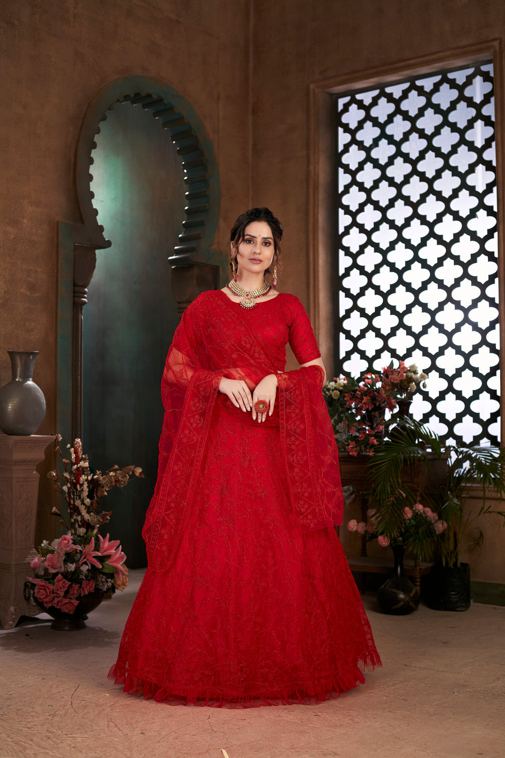 Red Thread Embroidered Net Wedding Wear Lehenga Choli