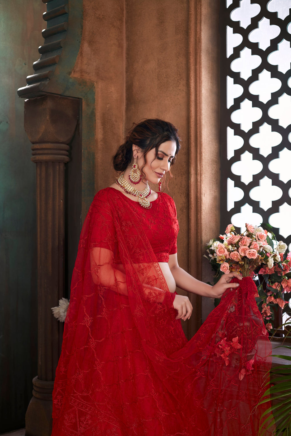 Red Thread Embroidered Net Wedding Wear Lehenga Choli
