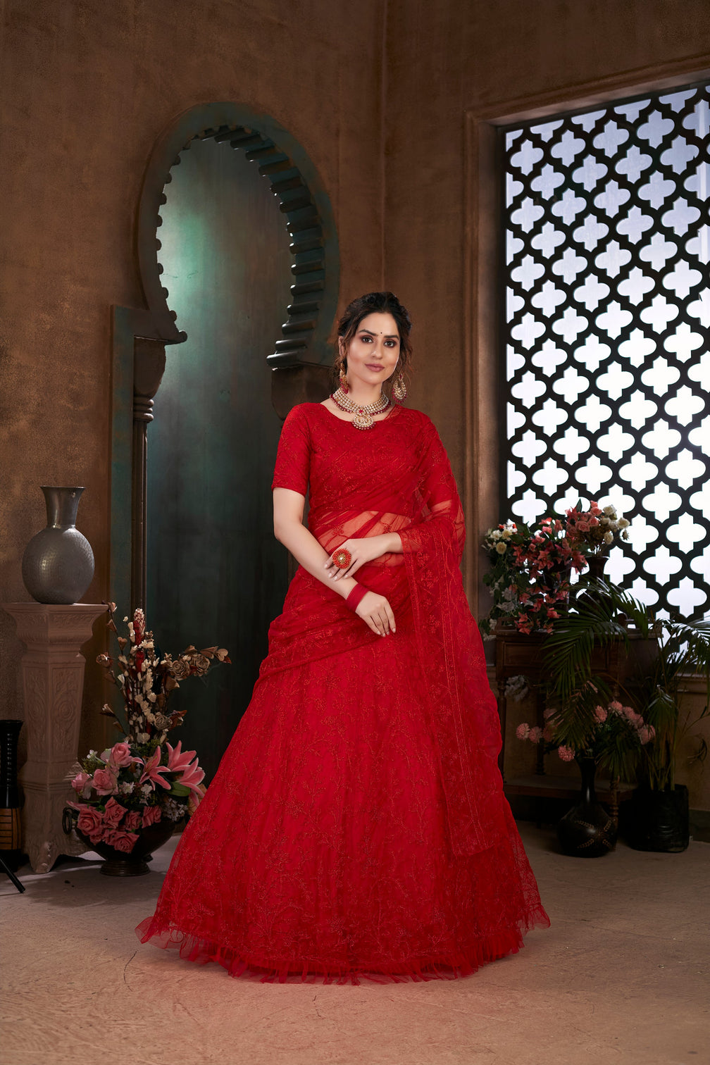 Red Thread Embroidered Net Wedding Wear Lehenga Choli