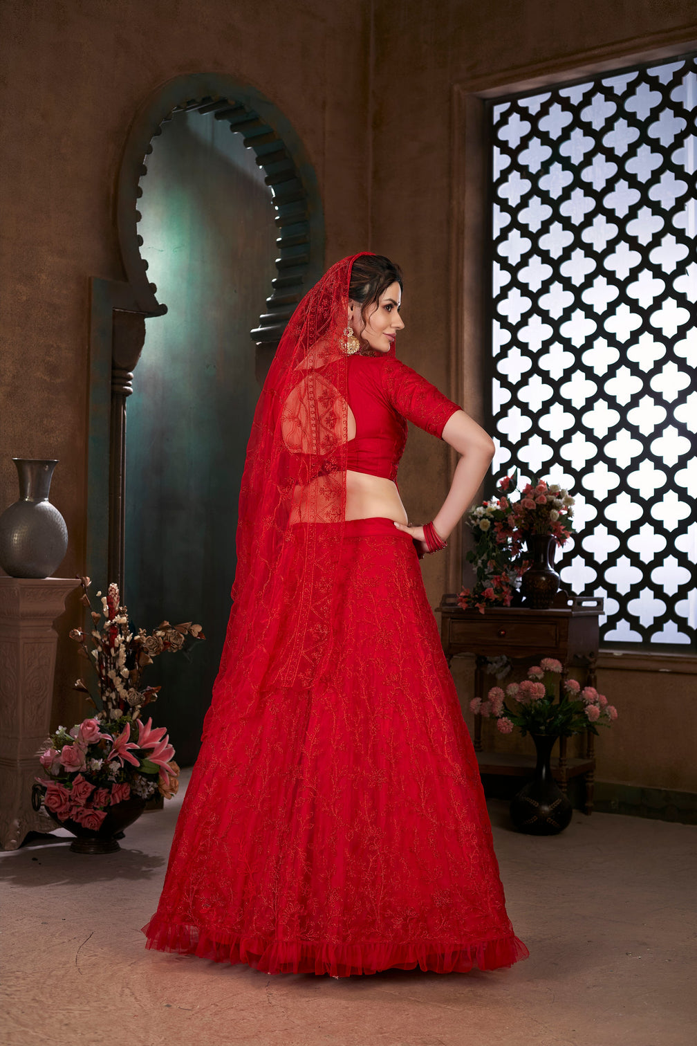 Red Thread Embroidered Net Wedding Wear Lehenga Choli