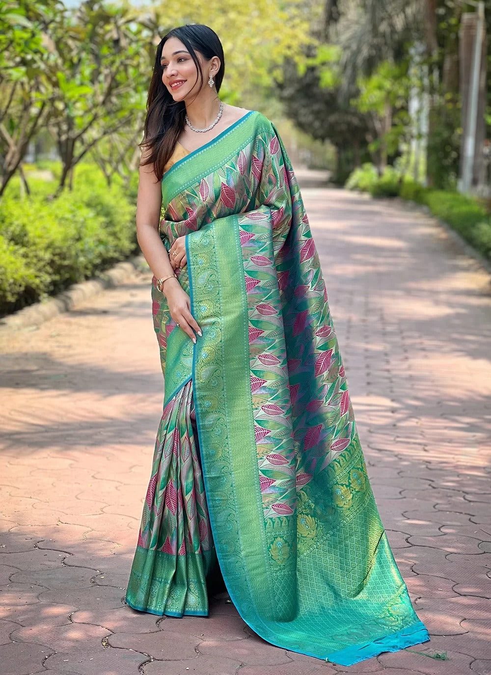Sea green kanchipattu silk saree for indian weddings with contrast weaving border