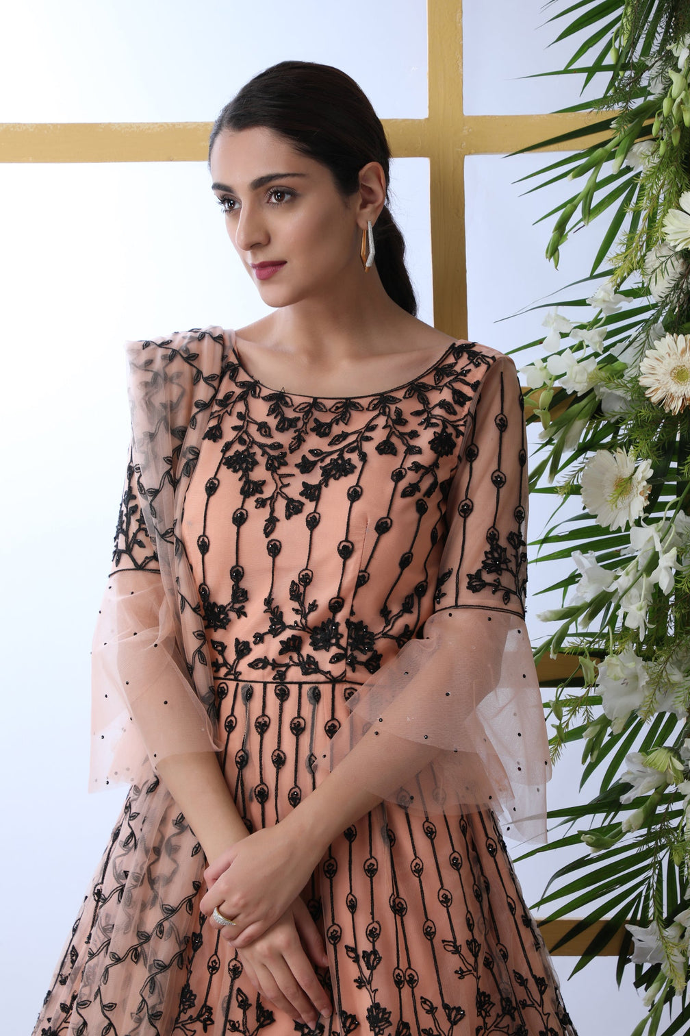 Sensational Peach Colored Soft Net Base Festive Wear Designer Gown