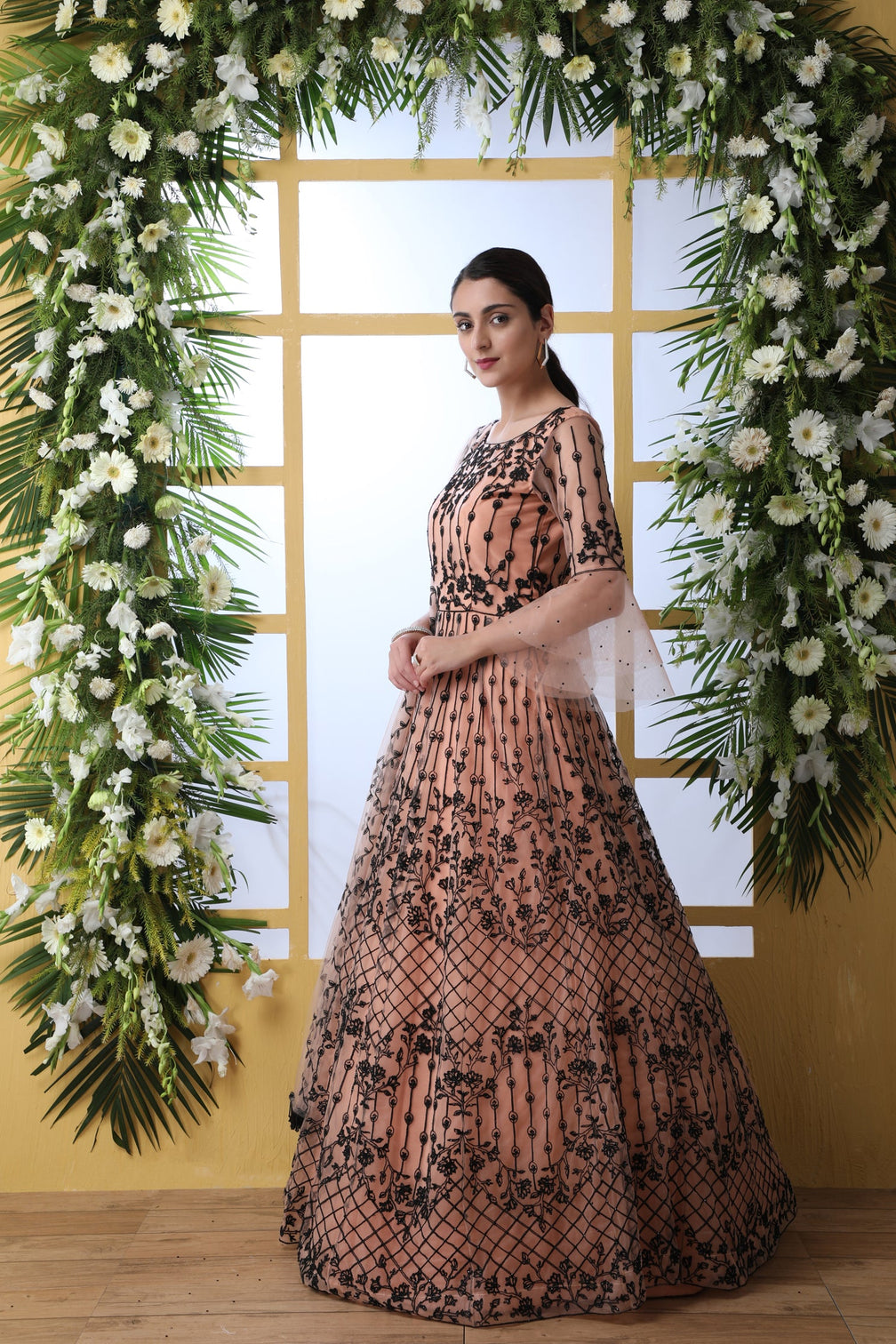 Sensational Peach Colored Soft Net Base Festive Wear Designer Gown