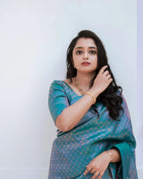 Snazzy Firozi Soft Banarasi Silk Saree with Glittering Blouse Piece
