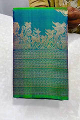 Embellished Rama Soft Banarasi Silk Saree With Gossamer Blouse Piece