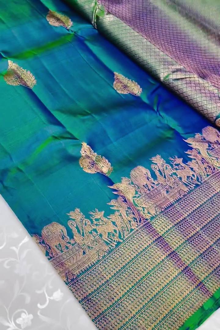 Embellished Rama Soft Banarasi Silk Saree With Gossamer Blouse Piece